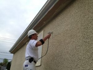 Peinture au fusil sur stucco